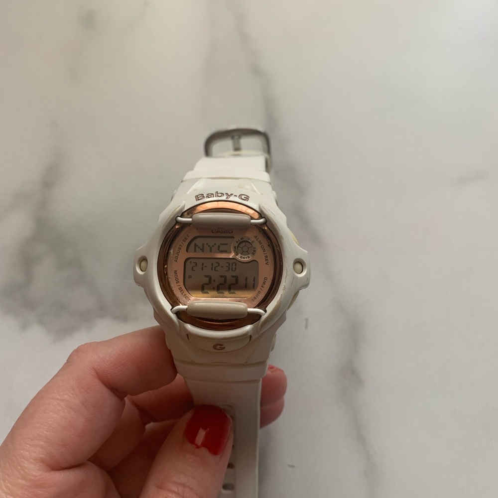 Baby- G white and rose gold face digital watch.